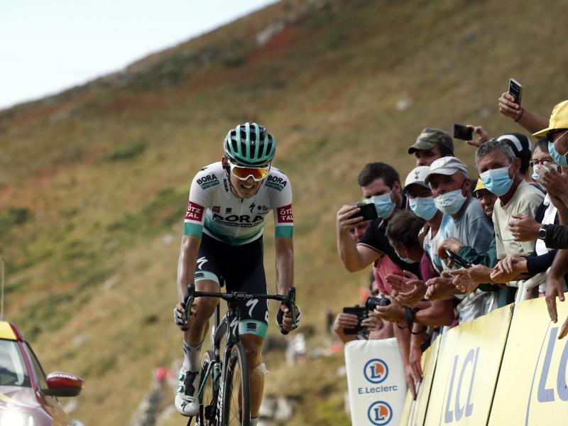 Zeigt starke Leistungen bei seiner zweiten Tour: Lennard Kämna (l). Foto: Benoit Tessier/Reuters/AP/dpa         